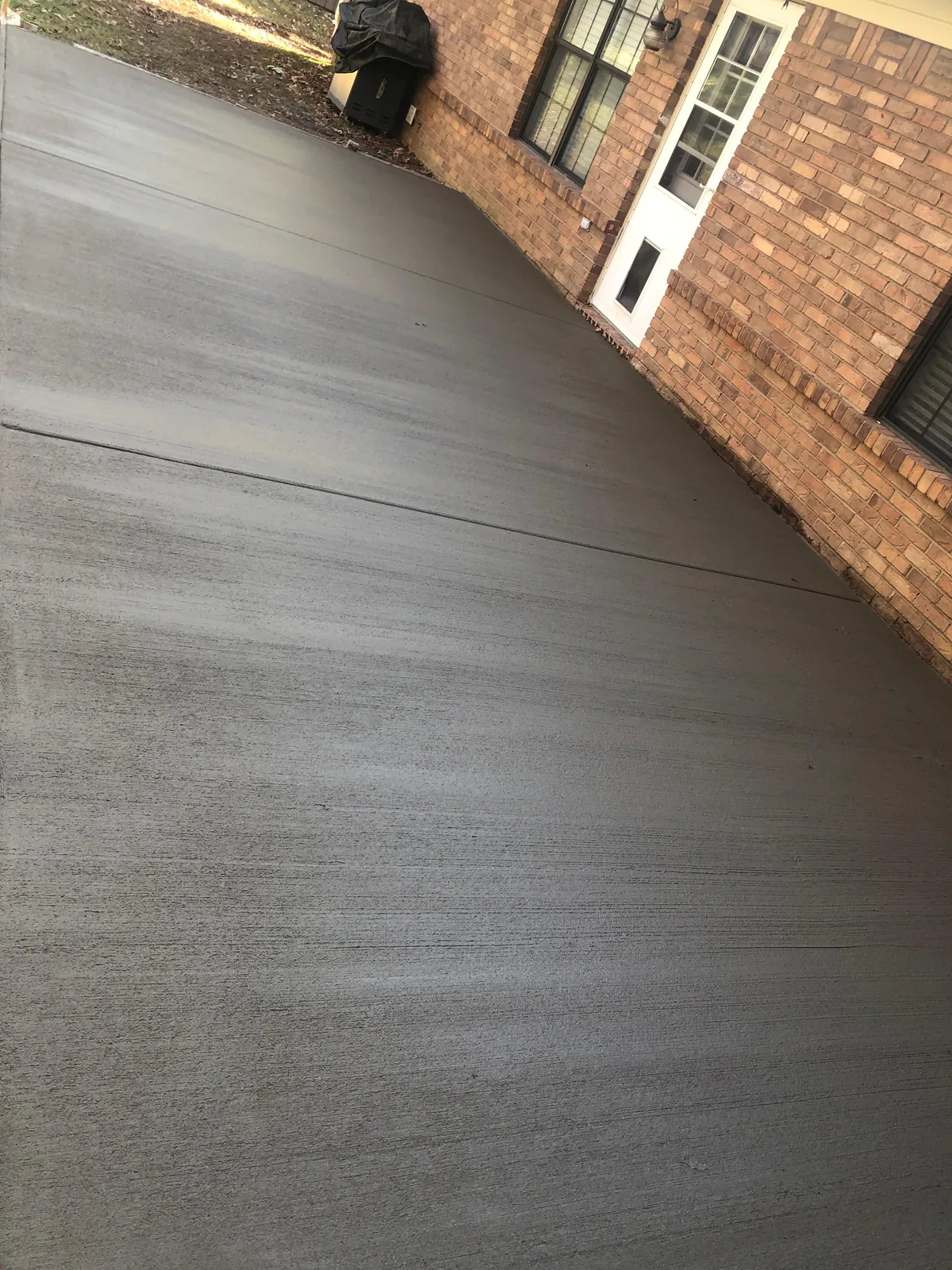 New concrete driveway freshly poured inside forms