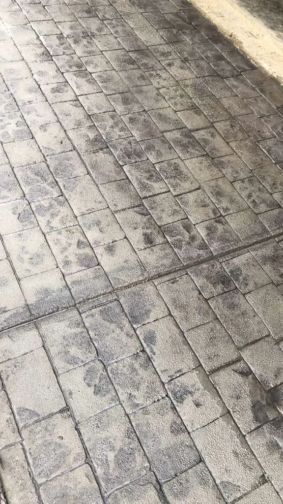 Charcoal cobblestone stamped concrete porch